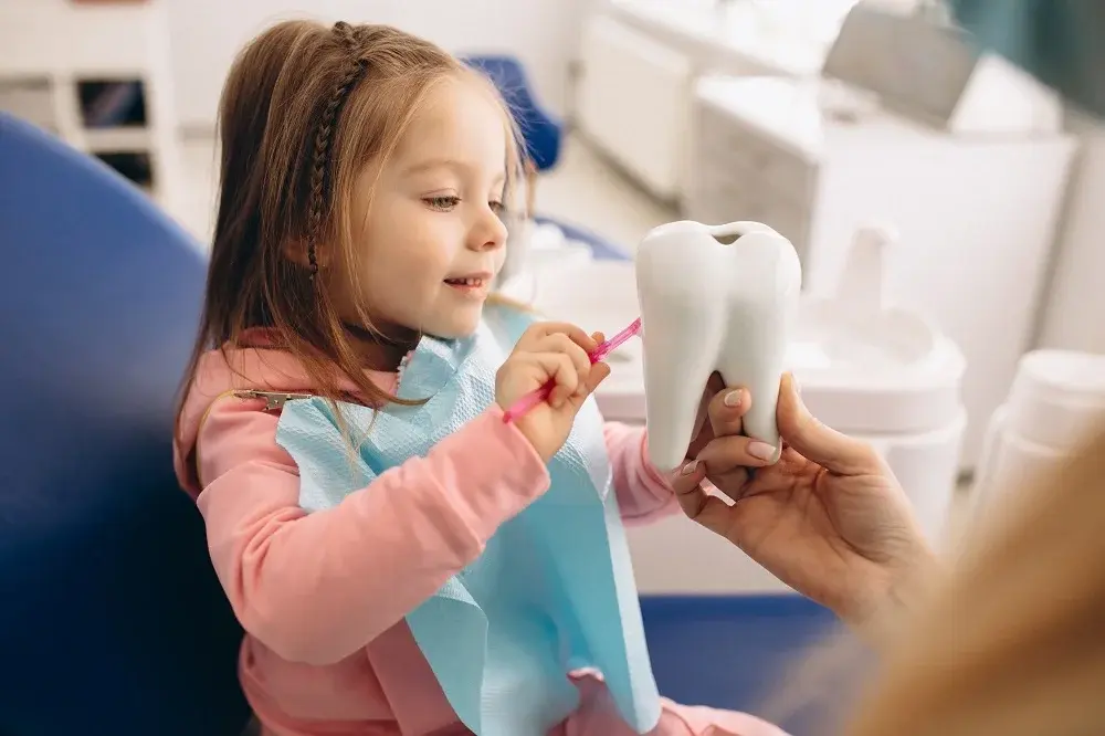Child receiving gentle dental cleaning and preventive care treatment - Pediatric dentistry services