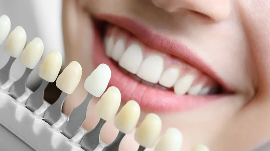 Patient smiling with new dental prosthetics